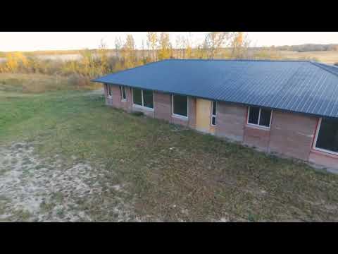 Our Rammed Earth House, all the windows are in!