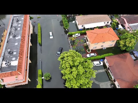 Drone shots of entire Miami, Fl neighborhood flooded, businesses flooded,  6-4-2022