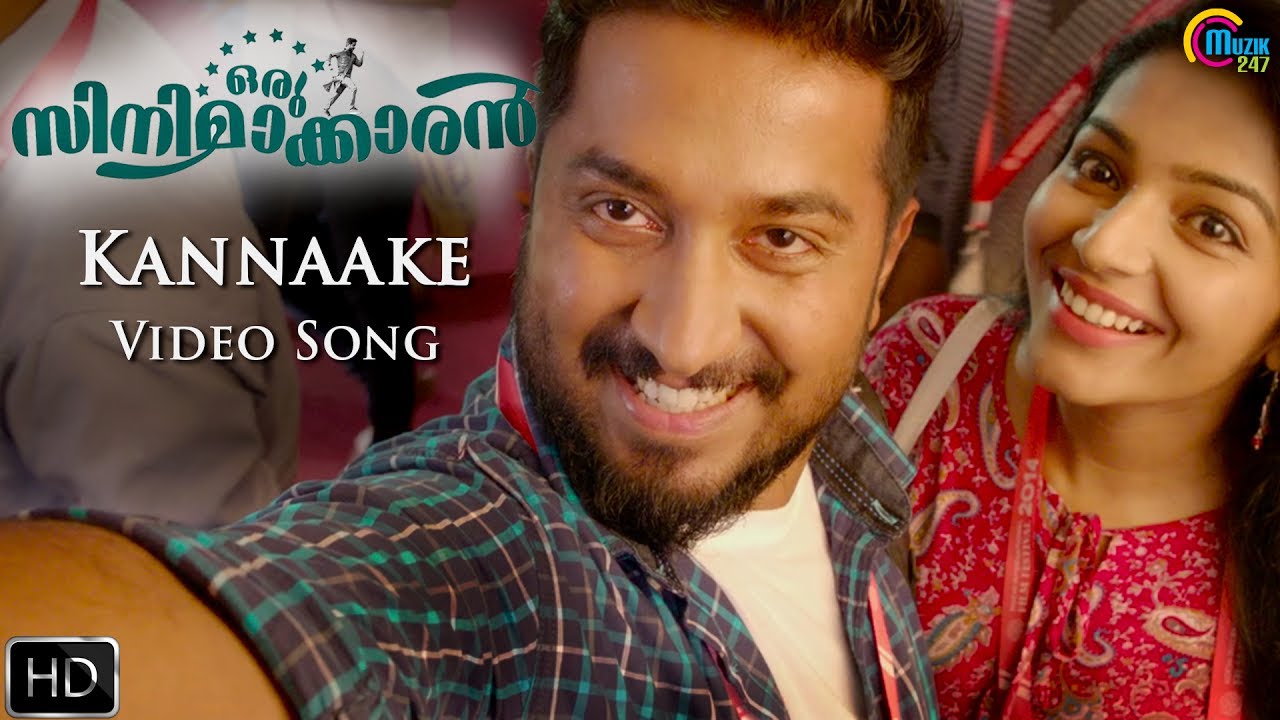 Kannake Lyrics  | Oru Cinemaakkaran | Anusree, Jacob Gregory, Lal, Rajisha Vijayan, Renji Panicker, Vijay Babu, Vineeth Sreenivasan | Teenu Tellance, Vineeth Sreenivasan | Bijibal
