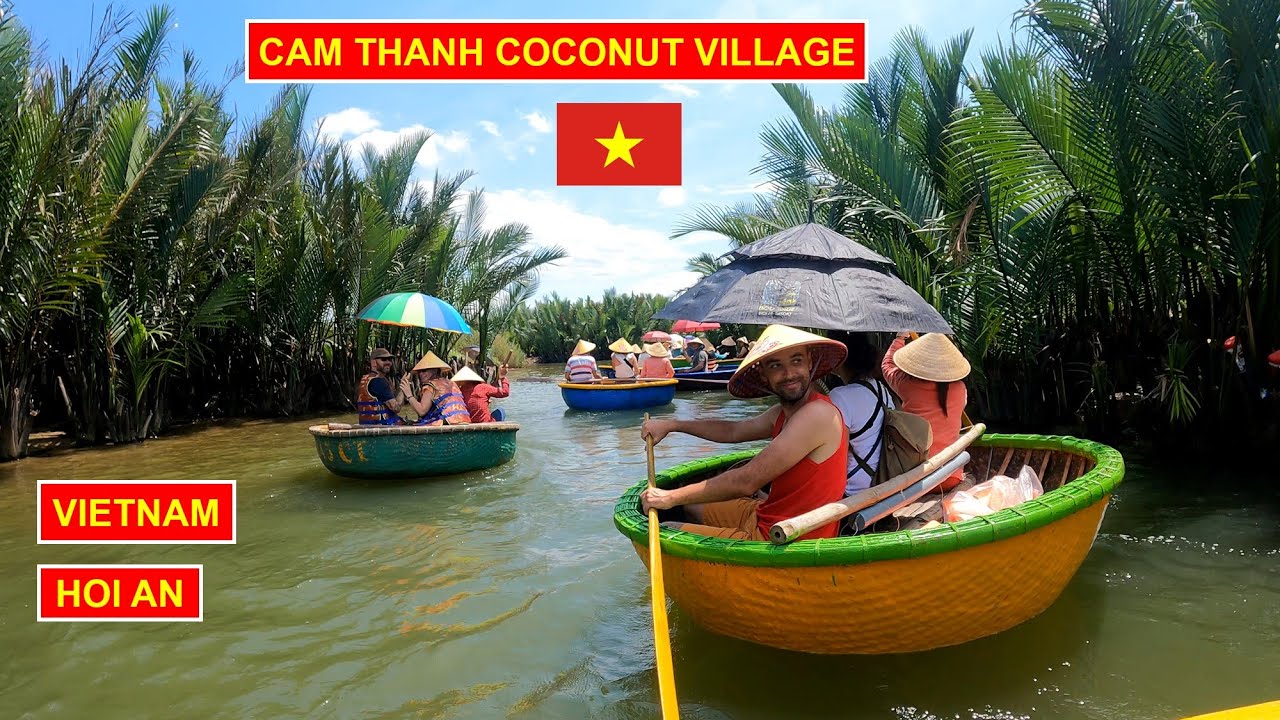 Tourists immerse themselves in the charm of Cam Thanh Coconut Village, gliding through serene waters on a basket boat.