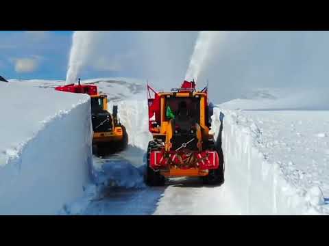 Epic Snow Battle in Norway: Powerful Snowplows Carving Through the Mountains!
