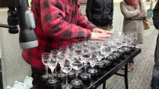 Street artist playing Hallelujah with crystal glasses