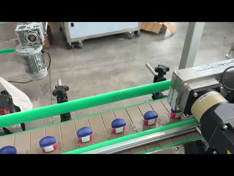 Double-sided labeling machine for small cosmetic bottles