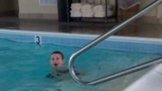 Max jumps into the pool.