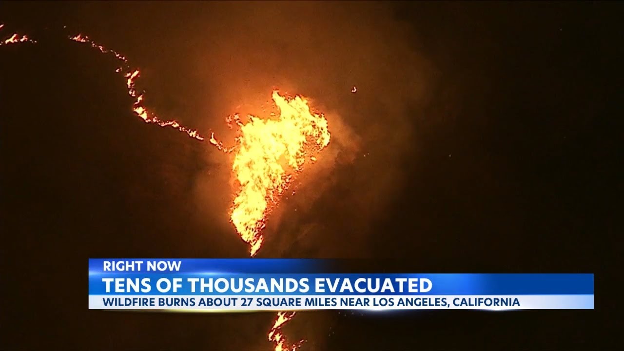 Residents flee Southern California wildfires threatening 35,000 structures