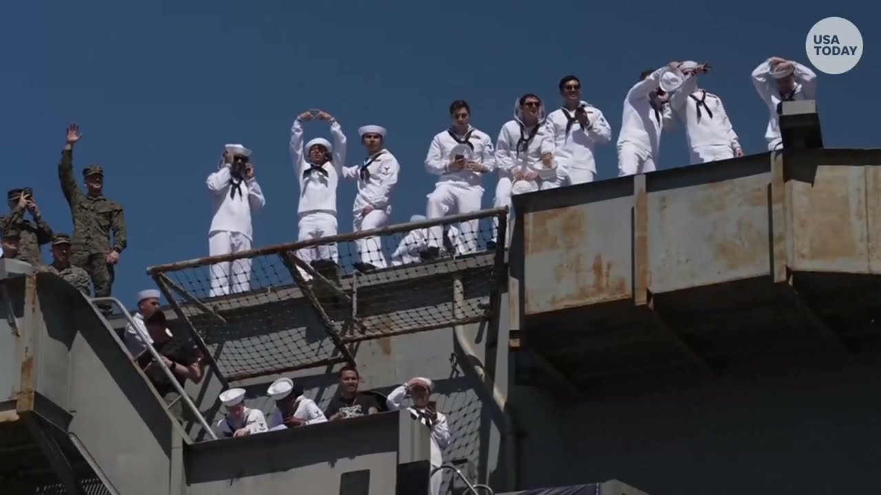 USS Abraham Lincoln sailors wave to crowd after docking in San Diego