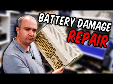 the repair of an Amiga 500+ computer with a damaged motherboard due to a leaking battery.