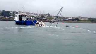 preview picture of video 'Commando towing sunken motor boat in holyhead marina.'