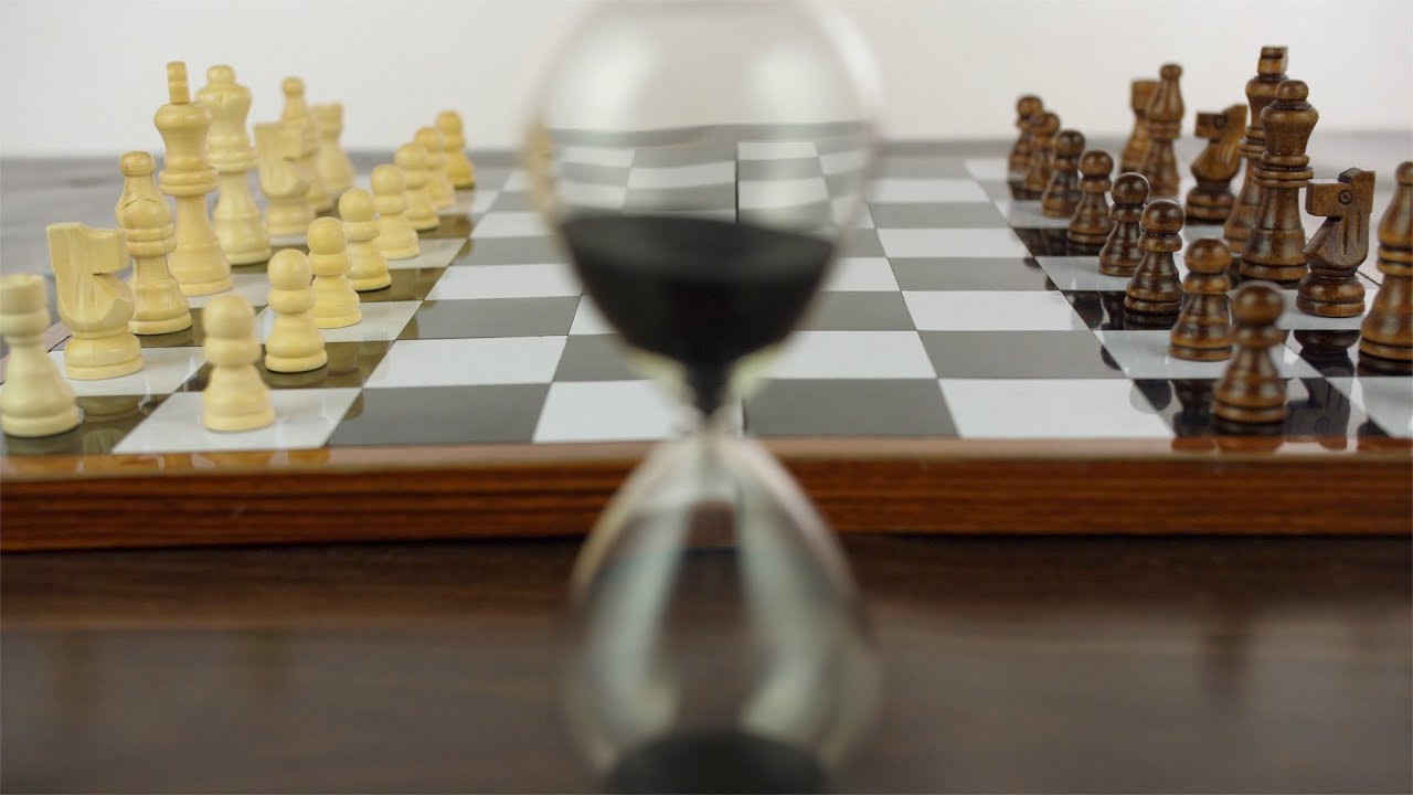Closeup shot of black and white chess pieces on a checkered bo... | Indian Stock Footage | Knot9