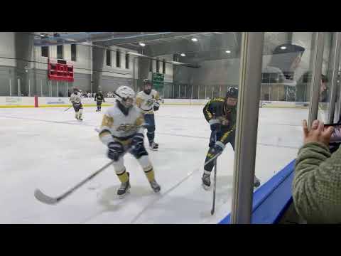 2 2 24 #9Lex Petrov shot on net #15Noah Adelman diving to keep the puck in Mitchell's offensive zone