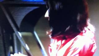 Andrea Parker in a leather skirt