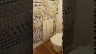 Album cover: Feature wall tiled