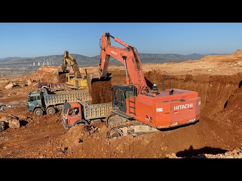 Hitachi Zaxis 670LC And Caterpillar 245B Excavators Loading Trucks
