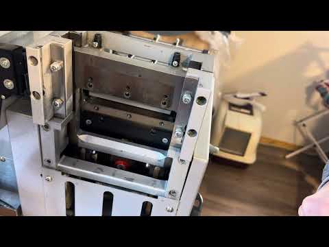 Changing blades on the Sheffield HC-530 cutting machine.