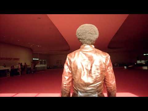 Three the Hard Way - Jim Kelly walks through an airport and catches a taxi