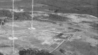 Agitated woman broadcasting on shortwave radio, circa 1983 (strange).