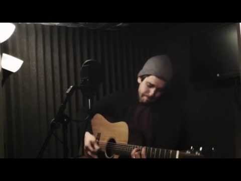 Adam Web performing his song Beautiful World in studio.