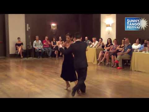  Lucas Gauto  and  Naima Gerasopoulou  are  dancing  to  the  tango  "  Emancipacion  "  by  Osvaldo Pugliese  at  Sunny Tango Festival  in  2018