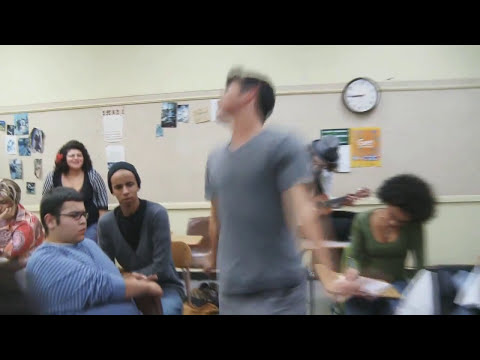 High School Sucks: The Musical trailer still with the core teen ensemble in a hallway tableau