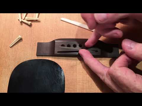 How to shim an acoustic under saddle pickup - over or under?