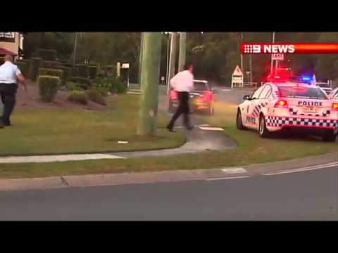 man in mini cooper vs police road block