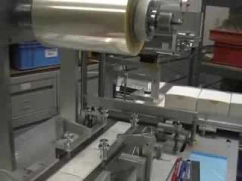 Minipack over wrapping machine