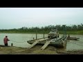 Nissan Patrol crossing the Rio Grande on a barge