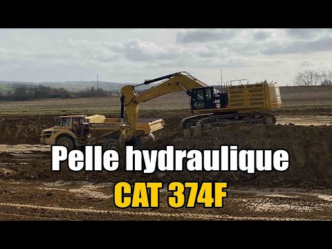 Cat 374F Large Excavator loading dumper Volvo a35g