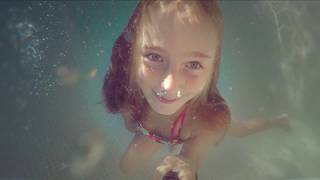 Carla Underwater - swimming underwater and blowing