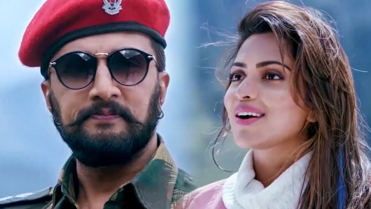 अमला पॉल सुदीप को भारत का राष्ट्रगान सुना रही है l Hebbuli Mov