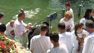 preview picture of video 'A Russian group renews vows of baptism in the Jordan River, Israel - Yardenit Baptismal Site'