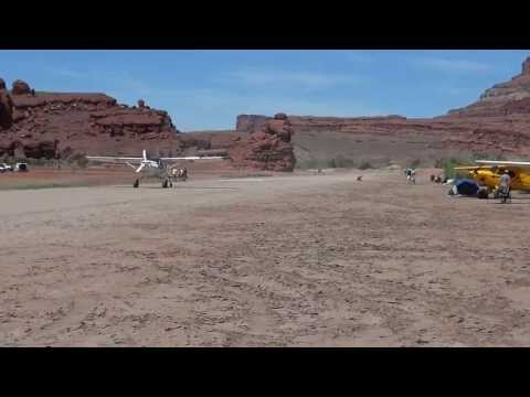 A highly modified Cessna 180 landing at Caveman Ranch, UT