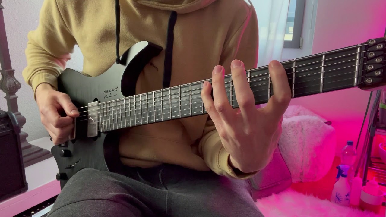 Guitarist playing the Arpeggios From Hell sweep-picking arpeggio run in A minor.