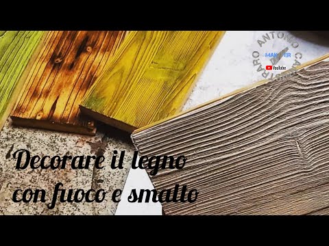 Dipingere e decorare il legno con fuoco e smalto. Shou sugi ban decoration. Bruciatura del legno