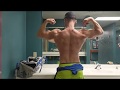 Posing after chest workout goofing off men's physique bodybuilding