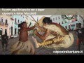jogar capoeira e bater maculele 