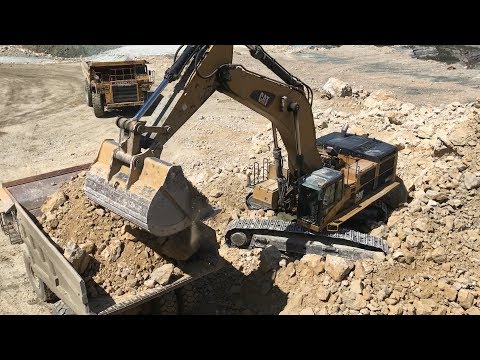 Caterpillar 385C Excavator Loading Caterpillar And Komatsu Dumpers - Kivos Ate