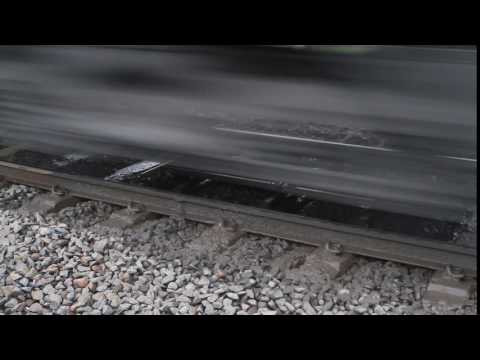 VLocity train passes over a mud hole