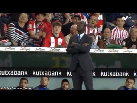 Deportivo La Coruna substitutes react in amazement after their manager Clarence Seedorf displays