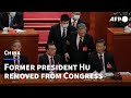 Unedited sequence of former Chinese president Hu unexpectedly leaving Congress | AFP