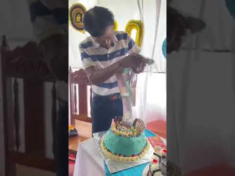 Lolo Reynaldo blowing his money cake