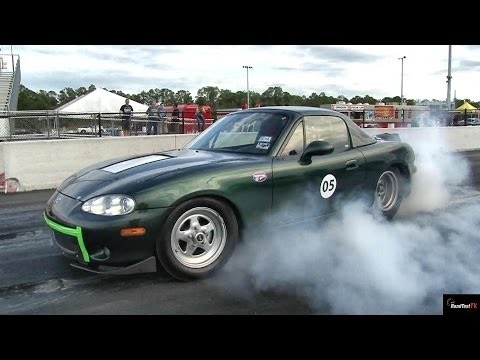 TESLA P85 Gets ZAPPED by Electric MIATA !!  - 1/4 mile Drag Race Video - Road Test TV ®