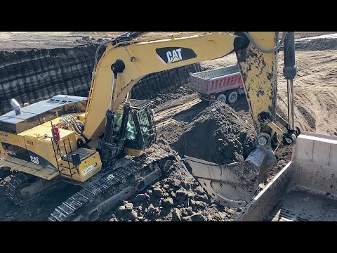 Caterpillar 374D Excavator Loading Mercedes And MAN Trucks - Interkat SA