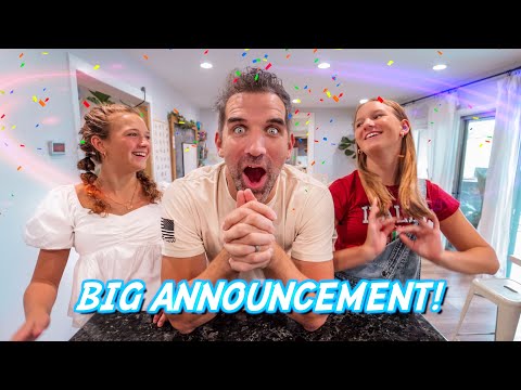 Three excited friends celebrate with confetti indoors, center person clasping hands and shouting, 'Big Announcement!' overlay visible in blue text across bottom.