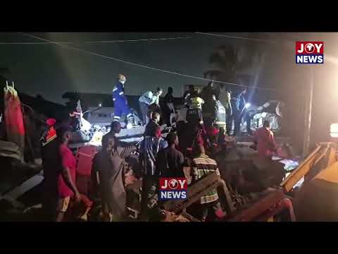 Residents of Okatabanman at Adenta Newsite help rescue two more children who were trapped.