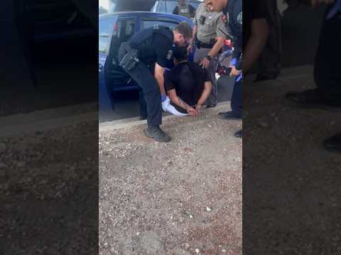 Gunshot wound visible on man's back after ICE shooting