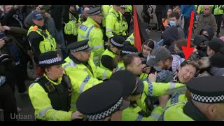 Woman hit in the face by police officer as counterprotesters scuffle during UKIP rally in Manchester