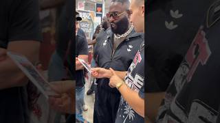 Rick Ross seen signing his autograph for his new album