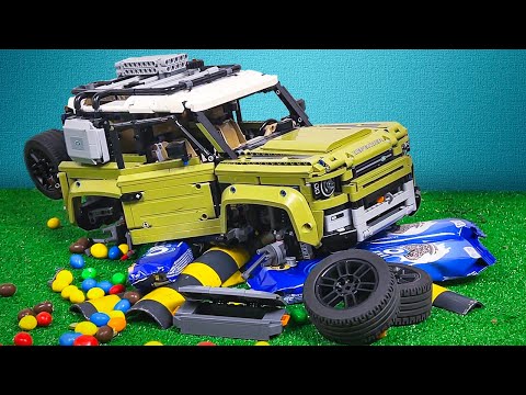 Lego Defender vs OREO Speed Bumps / Ramps with M&M's