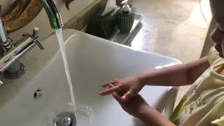 3 year old demonstrates proper hand washing technique